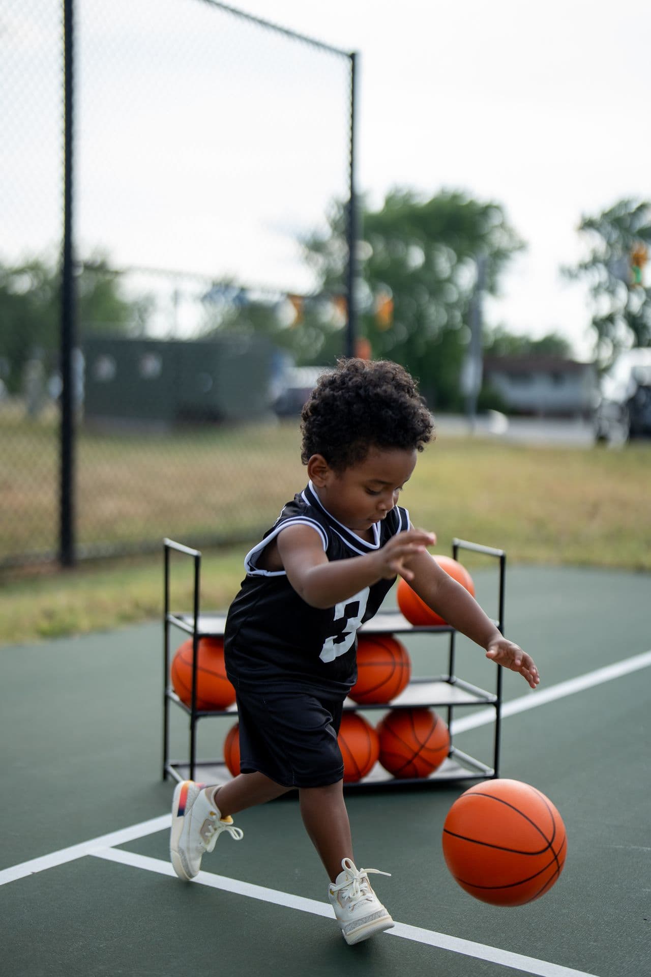 Young basketball player driving the ball down the court